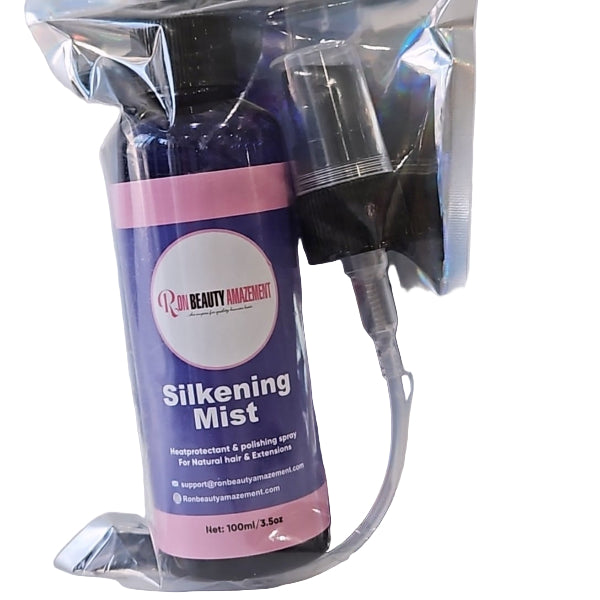 Silkening Mist spray bottle with pink label in clear packaging on a white background