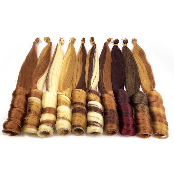 Set of hair extensions in various colors on a white background