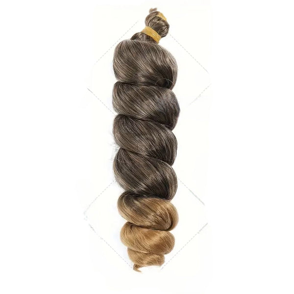 Braided hair extension with a gradient from brown to blonde on a white background